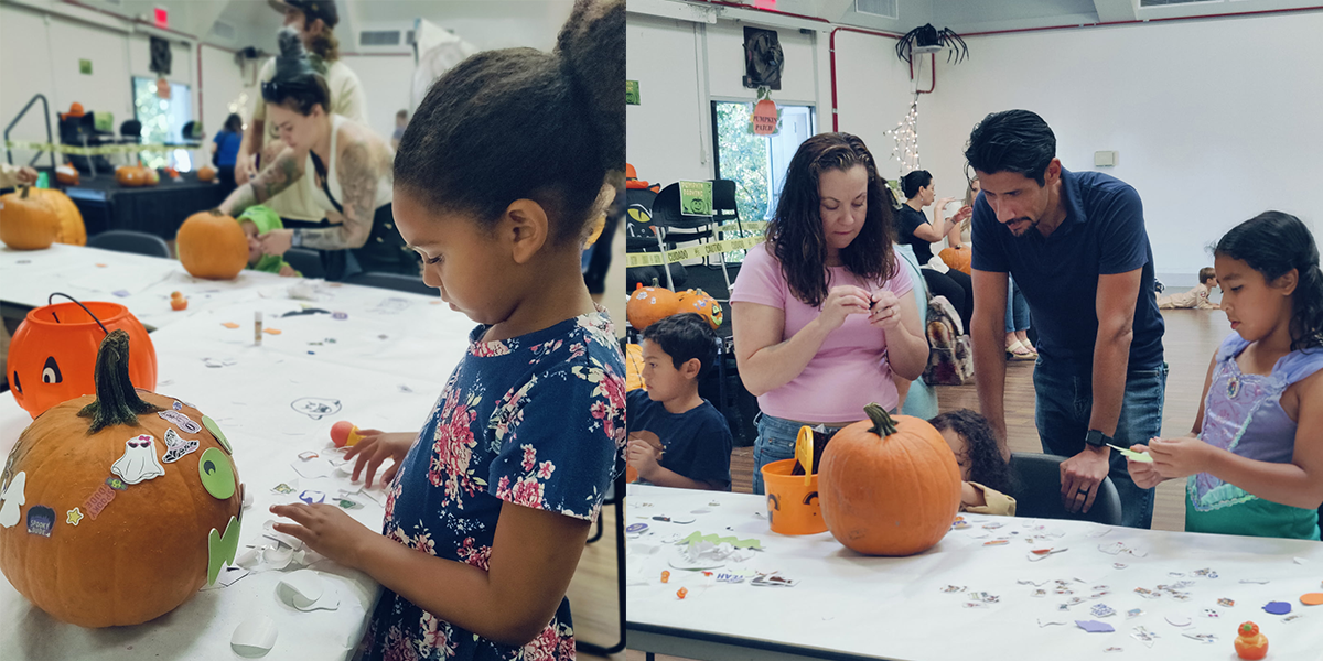 Young girls decorates jack-o-lantern